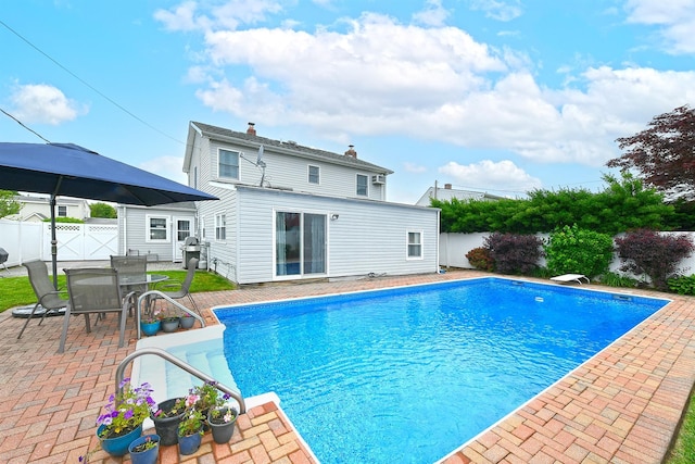 29 Andrew Ln, Levittown, NY 11756 - view of pool featuring a patio area, a grill, a gate, and a fenced backyard