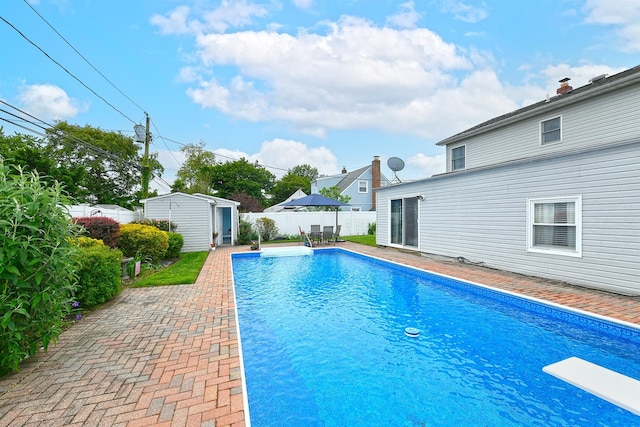 29 Andrew Ln, Levittown, NY 11756 - view of pool featuring a fenced backyard, a diving board, and a patio area