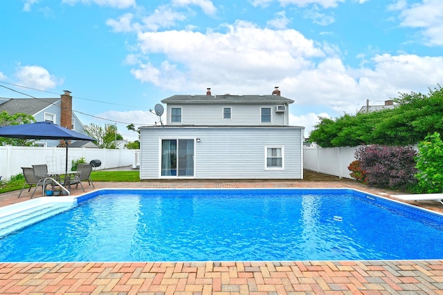 29 Andrew Ln, Levittown, NY 11756 - view of pool featuring a fenced backyard, a patio area, and a diving board