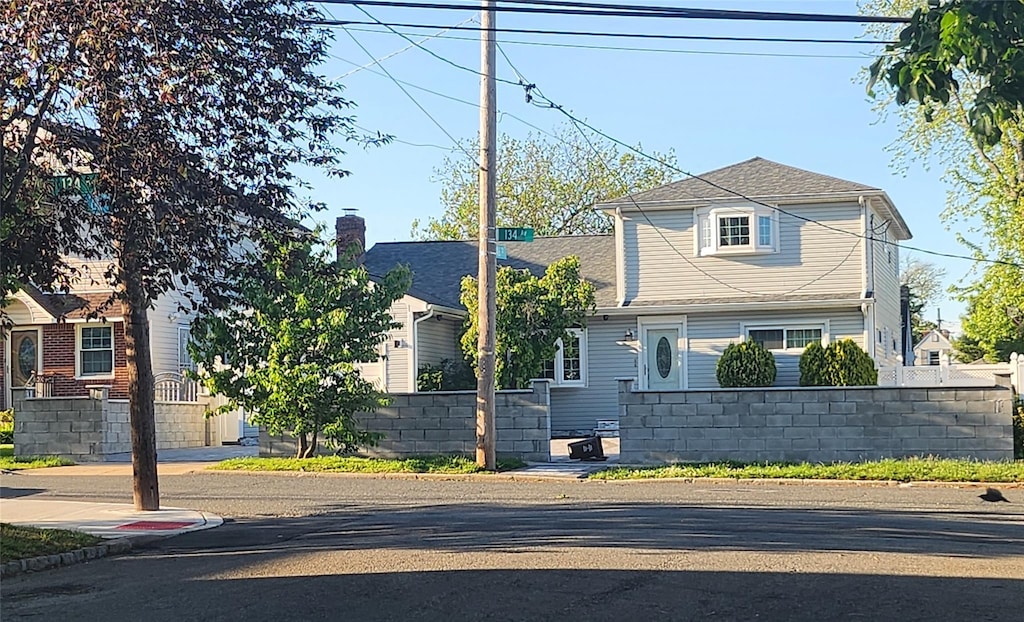 245-21 134th Ave, Rosedale, NY 11422 - view of front facade with a shingled roof