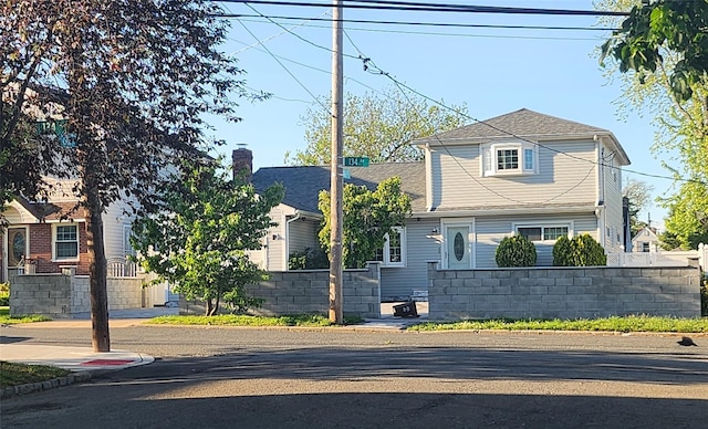 245-21 134th Ave, Rosedale, NY 11422 - view of front facade with a shingled roof
