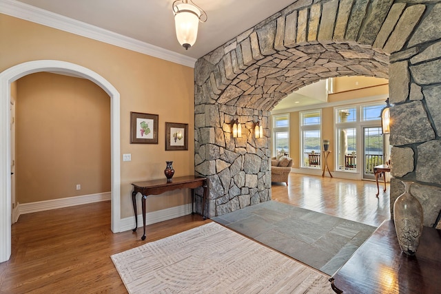 436 Steuben St, Call Listing Agent, NY 14891 - foyer entrance featuring arched walkways, baseboards, wood finished floors, and ornamental molding