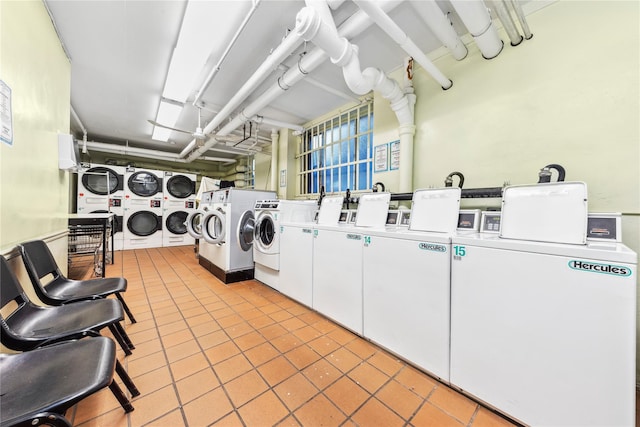 5355 Henry Hudson Pkwy W Unit 4G, Bronx, NY 10471 - shared laundry room with stacked washer / dryer, washer and dryer, and light tile patterned floors
