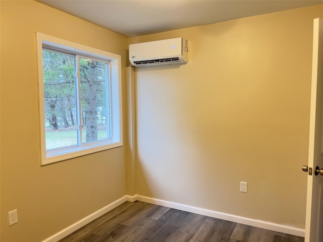 107 Pinewood Rd, Cochecton, NY 12726 - unfurnished room with an AC wall unit, baseboards, and dark wood-type flooring