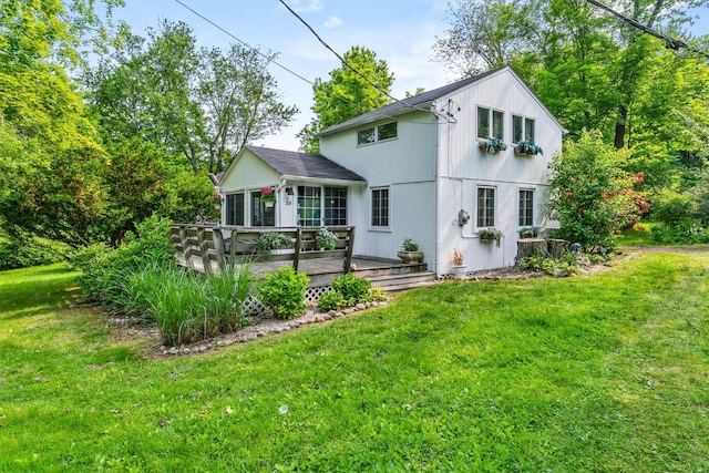 3300 Baker St Unit 20, Mohegan Lake, NY 10547 - rear view of property featuring a wooden deck, a sunroom, and a yard