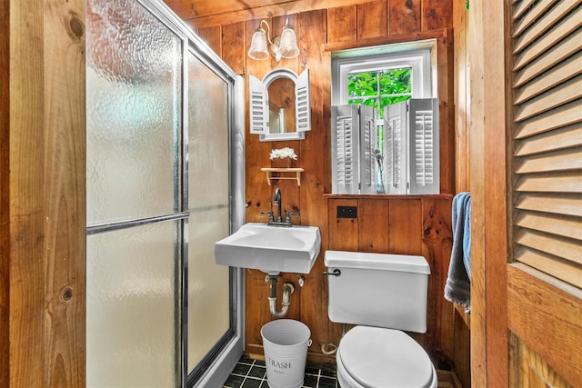 3300 Baker St Unit 20, Mohegan Lake, NY 10547 - full bathroom featuring toilet, wood walls, a stall shower, a sink, and tile patterned flooring