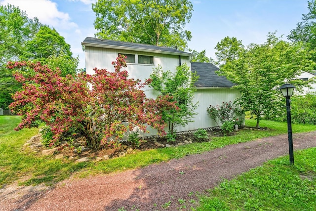 3300 Baker St Unit 20, Mohegan Lake, NY 10547 - view of side of home featuring roof with shingles