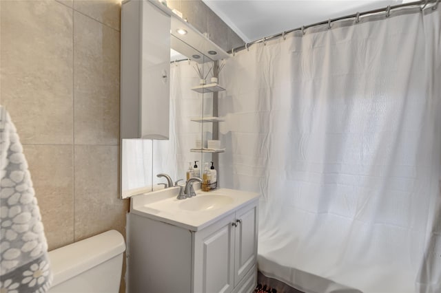 221 Middle Neck Rd Unit M-4, Great Neck, NY 11021 - bathroom with tile walls, vanity, and a shower with shower curtain