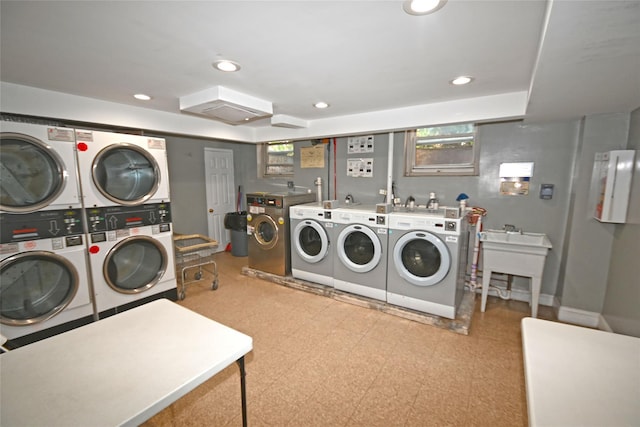 221 Middle Neck Rd Unit M-4, Great Neck, NY 11021 - communal laundry room with stacked washing machine and dryer, light floors, washer and clothes dryer, and recessed lighting