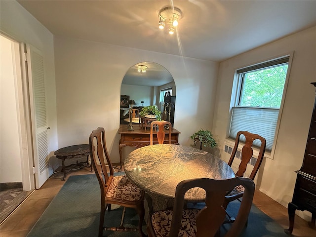 177 E Hartsdale Ave Unit 2Y, Hartsdale, NY 10530 - dining space featuring radiator heating unit and arched walkways