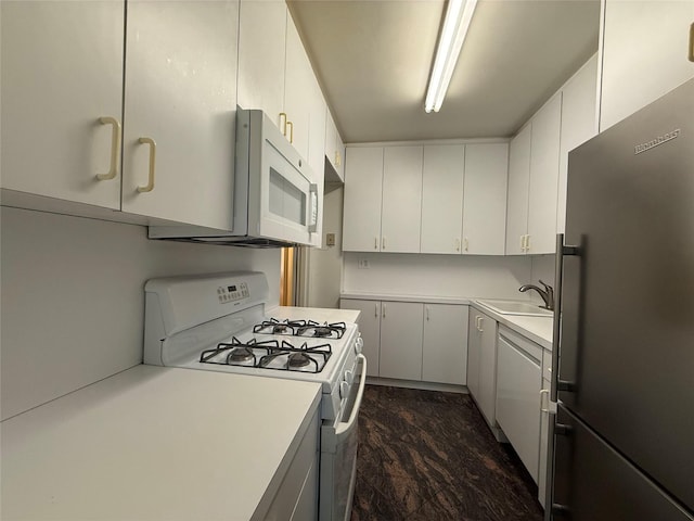 177 E Hartsdale Ave Unit 2Y, Hartsdale, NY 10530 - kitchen with white appliances, light countertops, a sink, and white cabinets