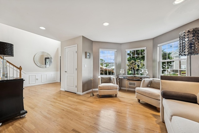 287 Atlantic Ave, Massapequa Park, NY 11762 - living area featuring light wood-style floors, recessed lighting, and wainscoting
