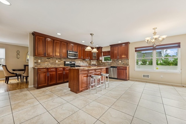 287 Atlantic Ave, Massapequa Park, NY 11762 - kitchen featuring stainless steel appliances, healthy amount of natural light, light tile patterned floors, and recessed lighting