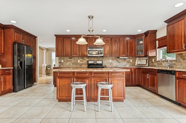 287 Atlantic Ave, Massapequa Park, NY 11762 - kitchen with stainless steel appliances, light tile patterned floors, recessed lighting, decorative backsplash, and a kitchen breakfast bar