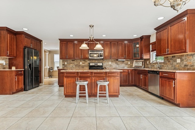 287 Atlantic Ave, Massapequa Park, NY 11762 - kitchen with appliances with stainless steel finishes, light tile patterned floors, tasteful backsplash, recessed lighting, and a breakfast bar area
