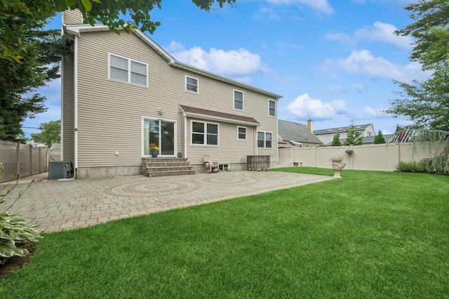 287 Atlantic Ave, Massapequa Park, NY 11762 - rear view of house with entry steps, a patio, a chimney, and a fenced backyard
