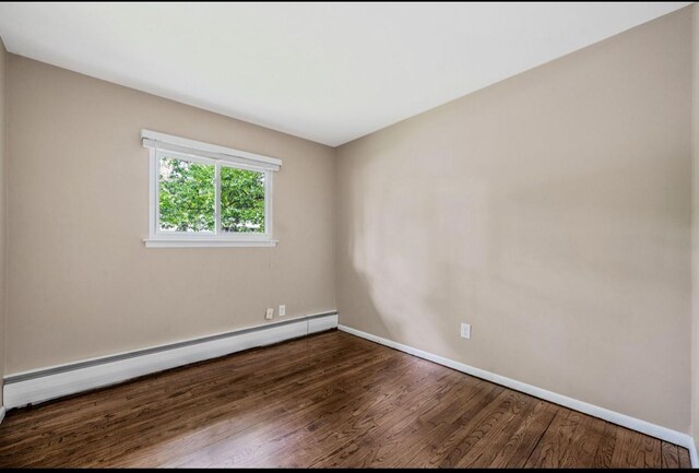 1 Leeward Ln, Commack, NY 11725 - unfurnished room with a baseboard radiator and wood finished floors