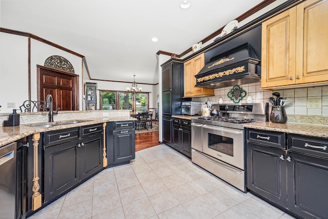204 Moore Rd, Germantown, NY 12526 - kitchen with stainless steel appliances, a sink, a chandelier, custom range hood, and tasteful backsplash
