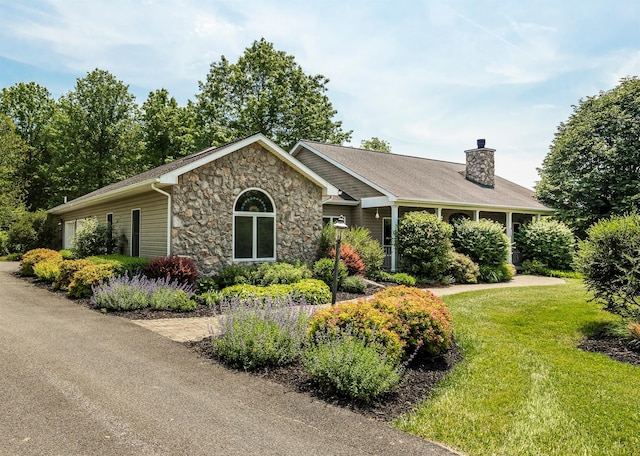 204 Moore Rd, Germantown, NY 12526 - view of front of house with stone siding, a chimney, and a front yard