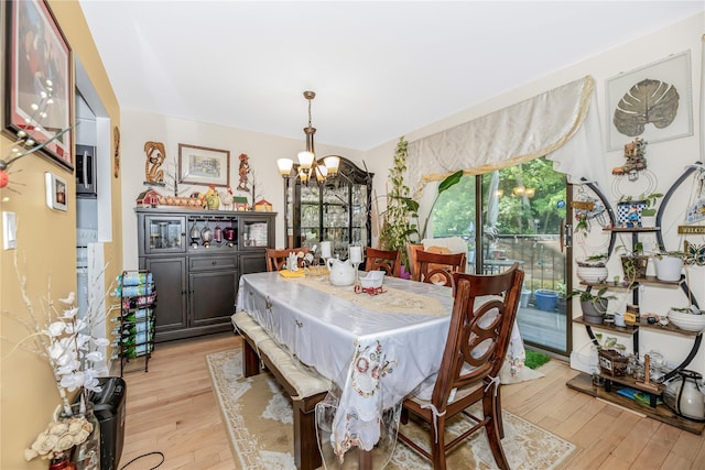 608 Kemeys Cv Unit 6-08, Briarcliff Manor, NY 10562 - dining area featuring a chandelier and light wood-type flooring