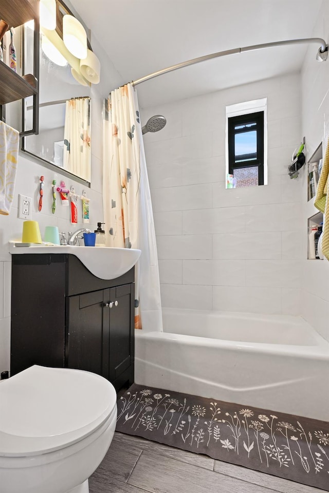 86-04 Grand Ave Unit 4D, Elmhurst, NY 11373 - bathroom featuring vanity, shower / tub combo with curtain, wood finished floors, and toilet