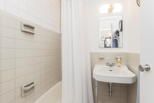 2 Fordham Hill Oval Unit 2F, Bronx, NY 10468 - bathroom with tile walls, shower / tub combo, and wainscoting