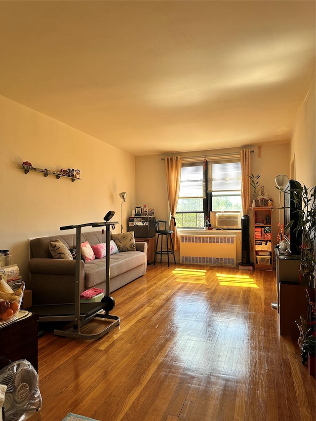 150-11 72nd Rd Unit 6A, Flushing, NY 11367 - living room with radiator heating unit, wood finished floors, and cooling unit