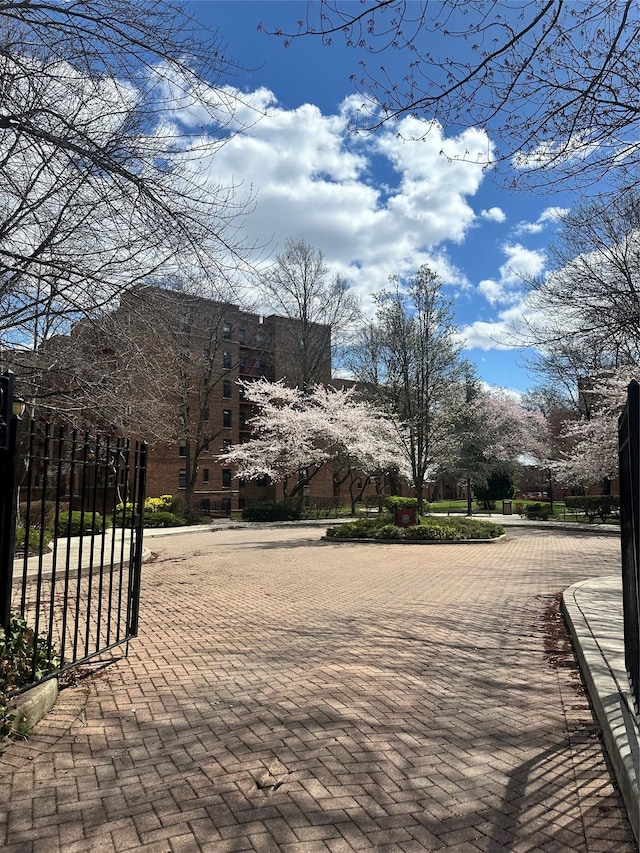 150-11 72nd Rd Unit 6A, Flushing, NY 11367 - view of decorative road featuring a gate and curbs