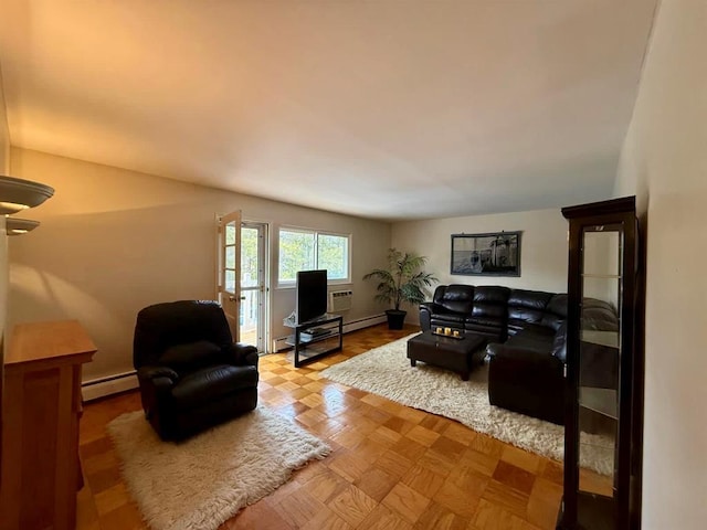 73 Adams Rd Unit 2B, Central Islip, NY 11722 - living room featuring baseboard heating and baseboards