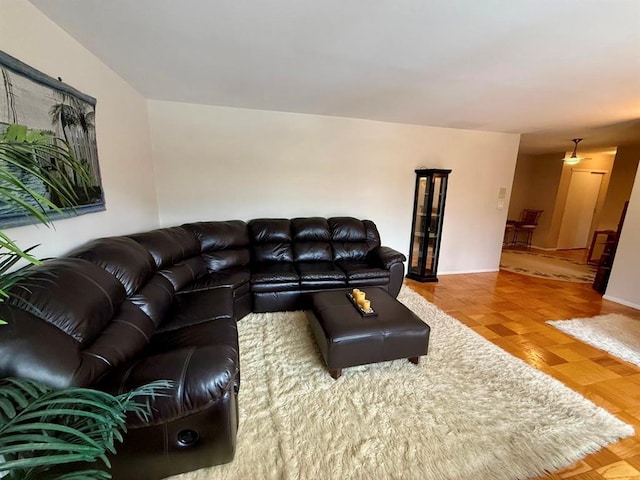 73 Adams Rd Unit 2B, Central Islip, NY 11722 - living room featuring baseboards