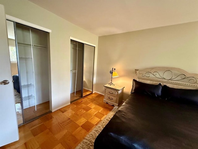 73 Adams Rd Unit 2B, Central Islip, NY 11722 - bedroom featuring two closets and baseboards