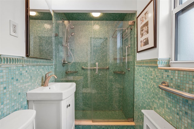 1299 Palmer Ave Unit 332, Larchmont, NY 10538 - full bathroom with tile walls, a shower stall, vanity, and a wainscoted wall