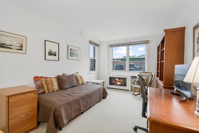 1299 Palmer Ave Unit 332, Larchmont, NY 10538 - bedroom featuring crown molding, light carpet, a glass covered fireplace, and an office area