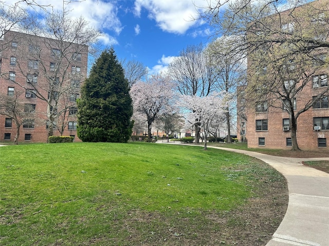 150-40 71st Ave Unit 2F, Kew Garden Hills, NY 11367 - view of home's community featuring a lawn
