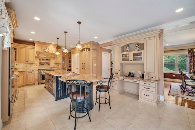 13 Locust Ln, Upper Brookville, NY 11545 - kitchen with stainless steel stove, a kitchen island with sink, a kitchen bar, light tile patterned floors, and backsplash