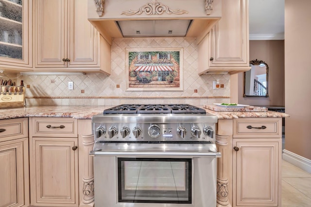 13 Locust Ln, Upper Brookville, NY 11545 - kitchen featuring high end stove, cream cabinetry, ventilation hood, decorative backsplash, and light stone countertops