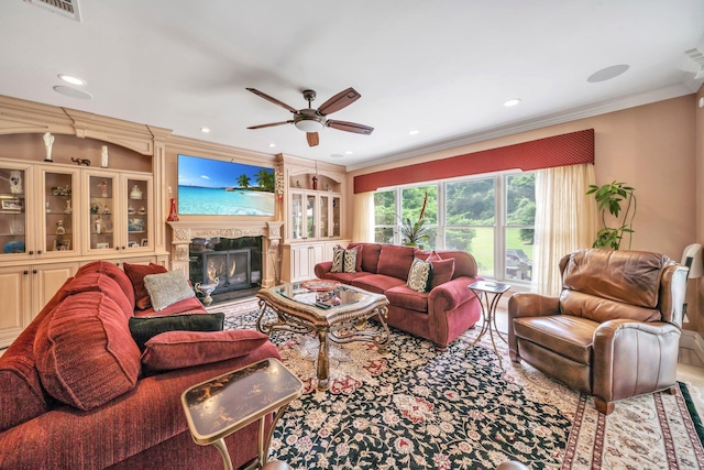 13 Locust Ln, Upper Brookville, NY 11545 - living area with ornamental molding, a ceiling fan, a glass covered fireplace, recessed lighting, and built in features