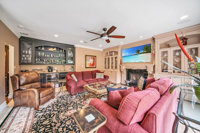 13 Locust Ln, Upper Brookville, NY 11545 - living area featuring bar with sink, crown molding, wine cooler, a warm lit fireplace, and ceiling fan