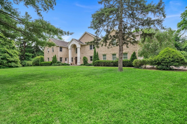 13 Locust Ln, Upper Brookville, NY 11545 - view of front of property featuring a front lawn and brick siding