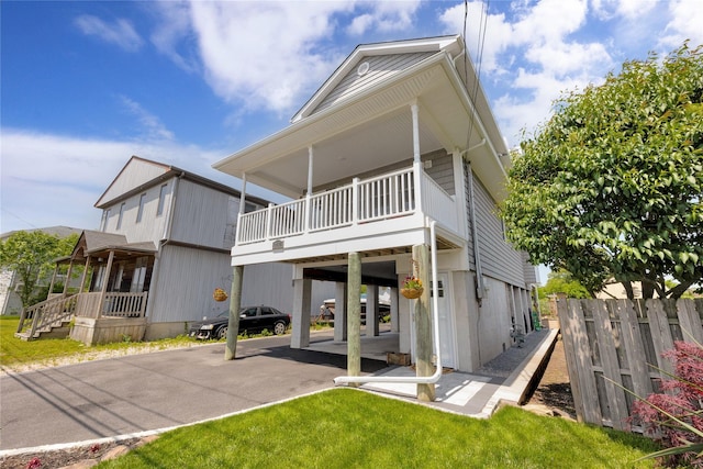 3717 Somerset Dr, Seaford, NY 11783 - rear view of house featuring a carport and a balcony