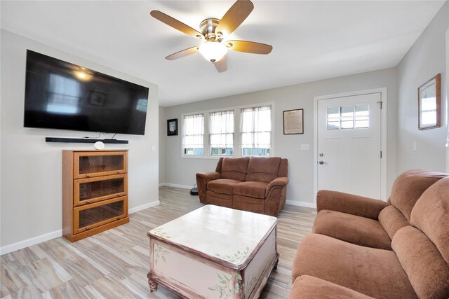 3717 Somerset Dr, Seaford, NY 11783 - living area with a ceiling fan, healthy amount of natural light, baseboards, and light wood finished floors
