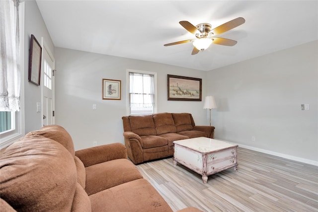 3717 Somerset Dr, Seaford, NY 11783 - living area with light wood-style flooring, a ceiling fan, and baseboards
