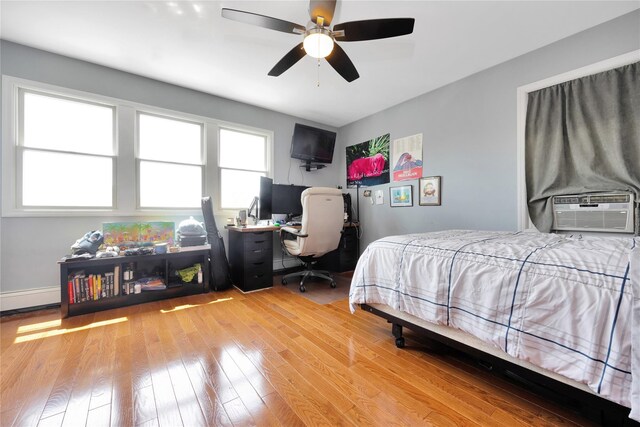 3717 Somerset Dr, Seaford, NY 11783 - bedroom featuring hardwood / wood-style floors, cooling unit, an office area, and ceiling fan