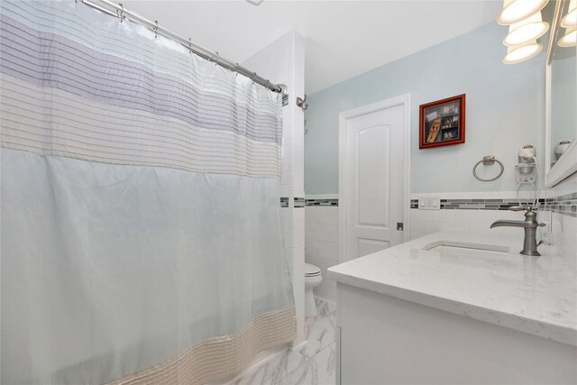 3717 Somerset Dr, Seaford, NY 11783 - full bath with tile walls, vanity, toilet, marble tiled flooring, and a shower with curtain