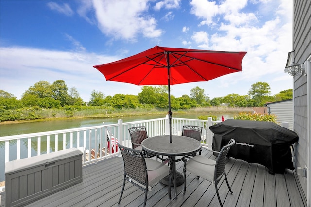 3717 Somerset Dr, Seaford, NY 11783 - wooden deck with outdoor dining area, a water view, and area for grilling