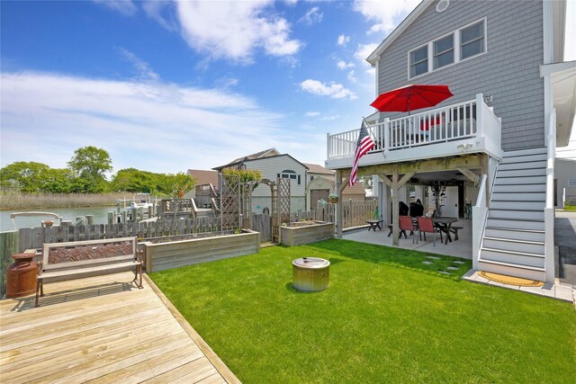 3717 Somerset Dr, Seaford, NY 11783 - view of yard with a patio, a vegetable garden, and a wooden deck