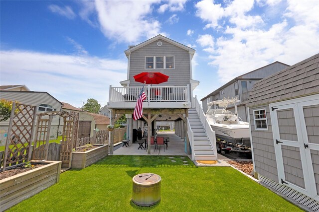 3717 Somerset Dr, Seaford, NY 11783 - rear view of property with a garden, a patio, stairs, and a deck