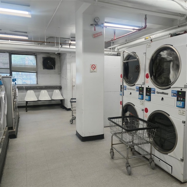 9 Fordham Hill Oval Unit 11D, Bronx, NY 10468 - community laundry featuring stacked washing machine and dryer, washer and clothes dryer, and tile patterned floors