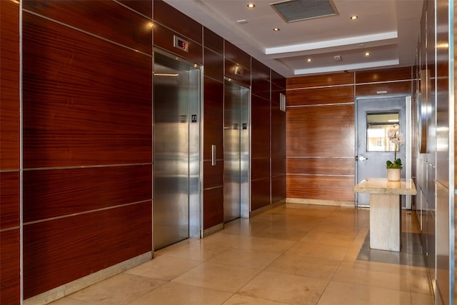 260 W Broadway Unit 2G, Long Beach, NY 11561 - hallway featuring a raised ceiling, light tile patterned flooring, and elevator
