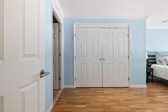 260 W Broadway Unit 2G, Long Beach, NY 11561 - hallway featuring ornamental molding, baseboards, and light wood-style floors
